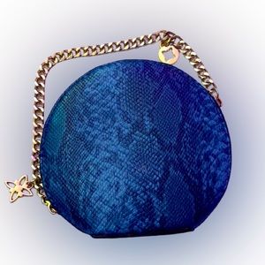 BCBGeneration Blue Faux Snake Skin Circular Wristlet With Gold Chain